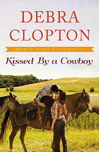 Kissed by a Cowboy (A Four of Hearts Ranch Romance Book 3)