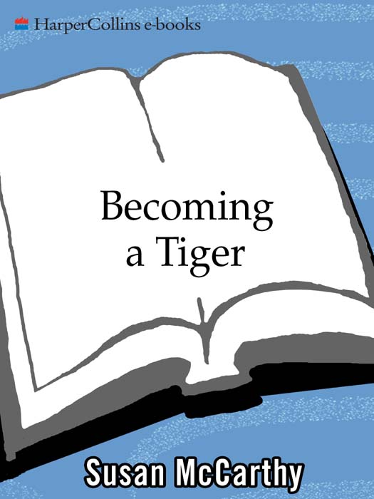 Becoming a tiger : how baby animals learn to live in the wild